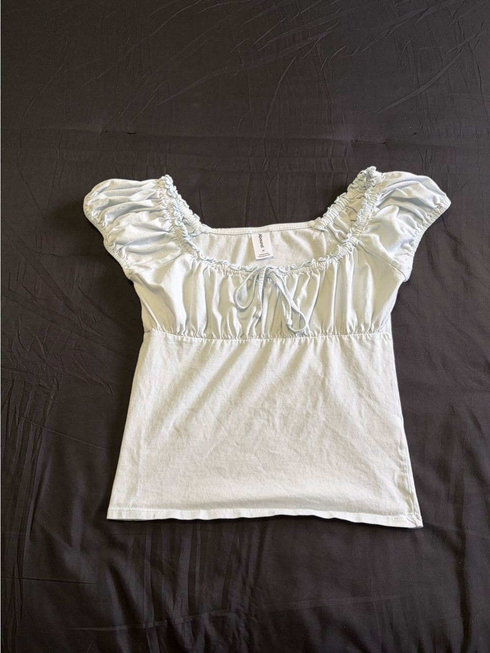 Abound light blue babydoll top in w/tie detail&ruffles. Size M.